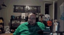 a man wearing headphones and a guinness shirt
