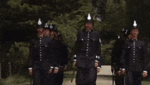 a row of police officers marching in a line
