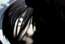 a close up of a person 's face with black hair and purple eyes