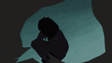 a silhouette of a person sitting in the dark