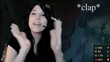 a woman wearing a headset with the word clap on the bottom