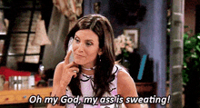 a woman is talking on a cell phone and saying oh my god , my ass is sweating !