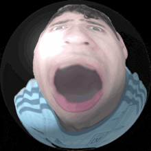 a close up of a man 's face with a large mouth