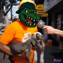 a man holding a dog with a crocodile mask on his head