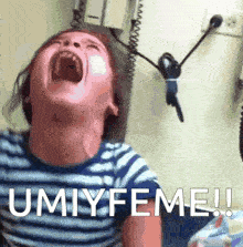 a child is screaming with the words umiyfeme written on the bottom