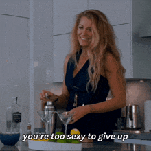 a woman in a kitchen with the words you 're too sexy to give up on the bottom