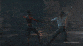 a man with horns is standing next to a woman with a ponytail in a dark room .