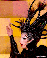 a woman is wearing a very elaborate costume and has a t4yce tumblr logo on the bottom right