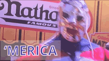 a sign that says merica is next to a person
