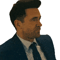 a man in a suit and tie is looking to his right