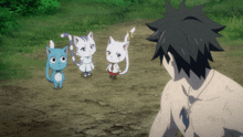 a man without a shirt is standing in front of three cartoon cats