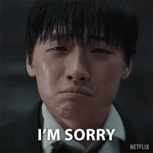 a man in a suit says i 'm sorry in a netflix ad