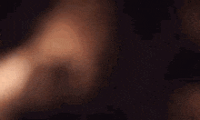 a close up of a person 's hand pointing at the camera with a ring on their finger .