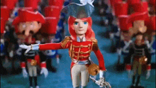 a cartoon doll in a red uniform is standing in front of a crowd of nutcrackers .