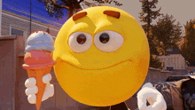a smiley face is holding an ice cream cone