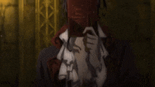 a woman is holding a red book in front of her face in a dark room .