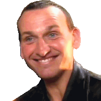 a close up of a man 's face with a smile