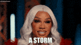 a woman with white hair says a storm in front of her