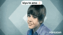 a young boy is smiling and looking at the camera with a speech bubble that says kiyu te amo .