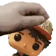 a person is putting a hat on a funko pop doll 's head .