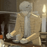a man in a yellow jacket is holding a spoon in his hand