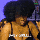a woman wearing glasses and a bra says " baby girllll "