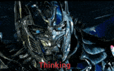 a picture of optimus prime from transformers with the word thinking below it