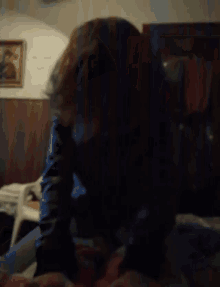 a blurry photo of a person 's face in a dark room