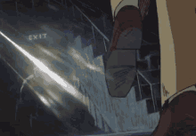 a person is walking down stairs in front of an exit sign .