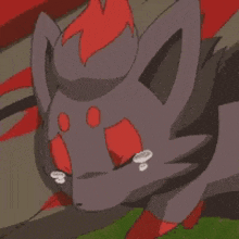 a cartoon cat with red eyes is crying while laying down .