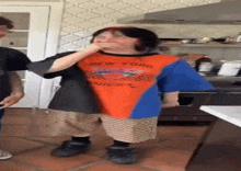 a person wearing a new york knicks shirt covering their mouth