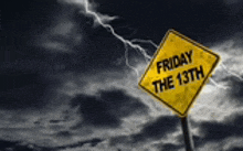 a yellow sign says friday the 13th in front of a stormy sky