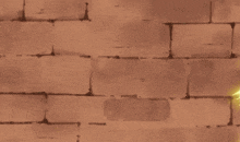 a cartoon character is standing in front of a brick wall with a yellow flame coming out of it .