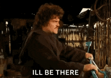 a man is holding a bicycle and saying ill be there