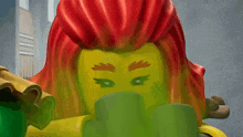 a lego girl with red hair and green eyes