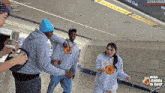 a group of people dancing in front of a sign that says ' nba daddy is back '