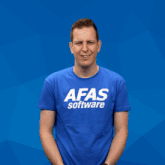 a man wearing a blue afas software shirt waves his hands