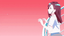 a girl in a school uniform is standing on a staircase looking at the sky .