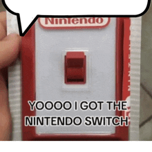 a person holding a nintendo switch with a speech bubble above it