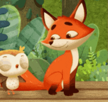 a fox and an owl are sitting next to each other on a fence