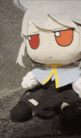a stuffed animal with white hair and red eyes sits on a carpet