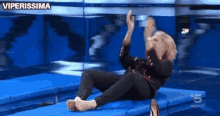 a woman is laying on a trampoline with the words viperissima behind her
