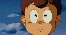 a close up of a child 's face with big eyes