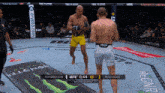 a boxing match between hermansson and rodrigues is being shown on the screen