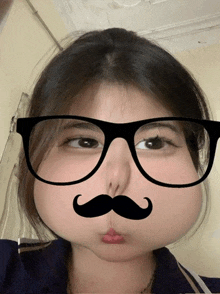 a girl wearing glasses and a fake mustache