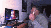a man is sitting in front of a computer screen that says 270 on it