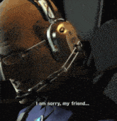 a bald man with glasses and headphones says " i am sorry my friend "