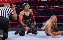 two women are wrestling in a ring with the word raw on the bottom