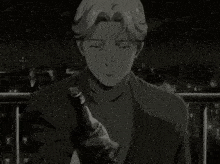 a black and white photo of a man holding a bottle