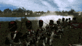 a group of soldiers are standing in front of a body of water with a flag that says ' a ' on it
